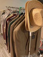 Rack of men's sport coats in various colors and fabrics
