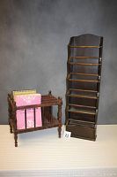 Photo showing both magazine holders side by side including visible books and sheet music in horizontal holder.