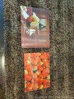 Photo showing two rectangular glass top trays on carpet. One tray displays a brown and wine bottle themed pattern, the other shows bright red strawberries.