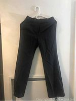Black women's pants shown hanging, front and back angles visible, size small