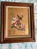 Framed painting of pink magnolia flowers with a bird on a golden background, signed by Robert Porter.