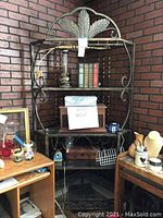 Full front view of baker’s rack showing structure and items