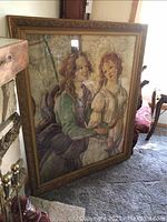 Large framed print of two women in classic attire leaning against a wall next to furniture and household items, showing size and condition.
