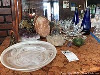 Overall lot showing bowls, crystals, geodes and salt rock on table