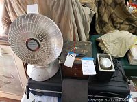 Vintage dental tools case with ultrasonic cleaner, heater heat dish, and foot light shown with price tags.