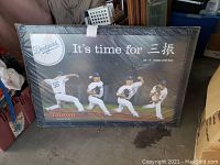 Framed Dodgers Hong Chi Kuo poster showing four pitching stances with text and Dodgers logo