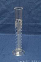 Photo of one borosilicate glass graduated cylinder with 270 ml capacity showing measurement markings