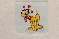 Close-up of the hand painted Disney Pluto etching with three red hearts above his head, signed by Sowa and Reiser, numbered 201/500.