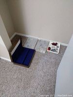 Photo showing empty flatware box with mirror and two plastic organizers with multiple compartments for jewelry or flatware pieces.