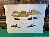 Full front view of shrink-wrapped mounted art depicting stylized walruses, ice shapes and a kayaker.