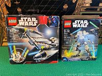 Front packaging view of both LEGO Star Wars sets 7656 and 75112