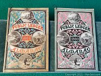Front covers of 1880 and 1881 Public Ledger Almanacs side by side, showing colorful, decorative designs and year prominently.