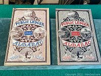 Front covers of two almanacs from 1882 and 1883, showing detailed colored artwork, logos, and year titles.