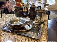 Full view of the lot items arranged on granite countertop showing the coffee pot, pitcher, bowls, and tray.