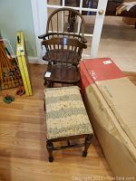 Photo showing a wooden arm chair with spindle back, a smaller wooden chair, and a wooden bench with torn fabric seat. All items have signs of wear and scratches.