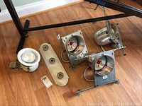 Photo showing all light fixtures including three Halo recessed housings, one white recessed fixture, and one 3-light bar fixture.