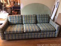 Front view of the teal and gold plaid loveseat showing all three seat and back cushions
