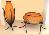Both amber tone elliptical glass vase and large amber jeweled glass bowl on irons stands shown together.