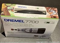 Closed box showing Dremel 7700 7.2V cordless rotary tool kit with two-speed control illustrations and product image.