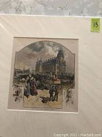 Photo shows a color etching of Town Hall and Market, Barrie, displayed with a single white mat. The artwork depicts a historic street scene with people, horse-drawn carriages, and the town hall building with distinct architectural features.