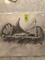 Photo of black and white print titled Retirement showing an old broken wooden wagon in grass, signed by artist C. Durban, dated 1980.