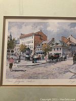 Full view of the framed artwork 'Place Jacques Cartier' showing the urban street scene with horses, people, and buildings, signed by Inge Claussen.