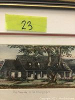Close-up of the framed etching depicting a French Canadian country cottage scene with artist's inscription and title visible