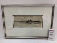 Full view of the framed print showing the artwork, white mat, and silver frame.