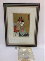 Front view of framed woodblock print with accompanying information sheet and auction tag visible