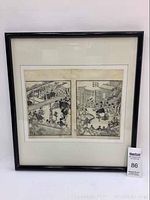 Full front view of the framed oriental print showing two black and white scenes within a black frame resting against a white wall, with MaxSold lot number visible.