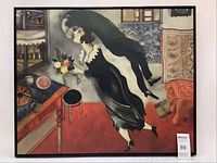 Front view of the framed canvas print reproduction of Marc Chagall's The Birthday painting showing the cubist/expressionist style image of a couple in mid-air embracing and kissing.