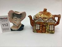Photo of lady head vase next to cottage ceramic teapot showing overall appearance and size