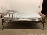 Full side view of bed frame with mattress and side rails