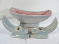 Photo of pink and gray glazed ceramic planter and two blue glazed ceramic candlestick holders, all ceramic pottery items.