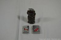 Overview of the three lighters including two Zippos and one decorative lighter