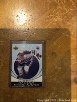 Front view of 2005 Upper Deck McDonald's Top Scorers hockey insert card featuring Wayne Gretzky in Edmonton Oilers uniform, protected in rigid plastic sleeve, showing player name and dynamic circular graphic design.