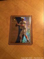 Front of the Peyton Manning rookie card showing holographic foil background and player image