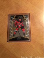 Front of the 2019-20 Upper Deck Allure hockey rookie card featuring Jack Hughes in New Jersey Devils uniform, card number 100, in protective plastic sleeve.