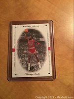 Front view of Michael Jordan 1999 SP Authentic basketball card showing Jordan mid-air with basketball, encased in protective plastic.