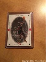 Front side of the 1999 SP Authentic Michael Jordan basketball card showing image of Jordan in Chicago Bulls uniform going for a shot, with minimal wear shown. Card is in a clear protective holder.