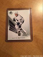 Front of hockey card featuring Auston Matthews in Toronto Maple Leafs white jersey number 34, with SP Authentic logo.