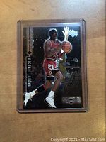 Front view of 1999 Upper Deck Black Diamond Michael Jordan basketball card in protective plastic sleeve.