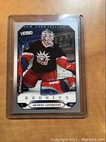 Front of the rookie hockey card showing Henrik Lundqvist in goalie gear with Victory logo and Rookie marking.