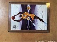 Front of 2005 Upper Deck SP Authentic Kobe Bryant card showing player in Lakers jersey.