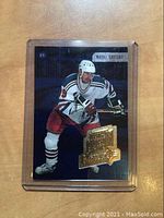 Front side of the 1999 Upper Deck SPx Wayne Gretzky hockey insert card showing player image and gold embossed text.