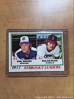 Front of 1977 Nolan Ryan and Phil Niekro baseball card showing player portraits and 'Strikeout Leaders' text.