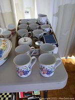 Full view of set lineup with floral designed Evesham cups in front