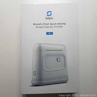 Image of the Selpic S1 white handheld printer box showing branding and model details.