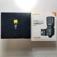 Nikon Z5 and Godox V860II-N boxes side by side