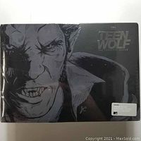 Front view of the sealed black collector's box with werewolf illustration and embossed Teen Wolf title.